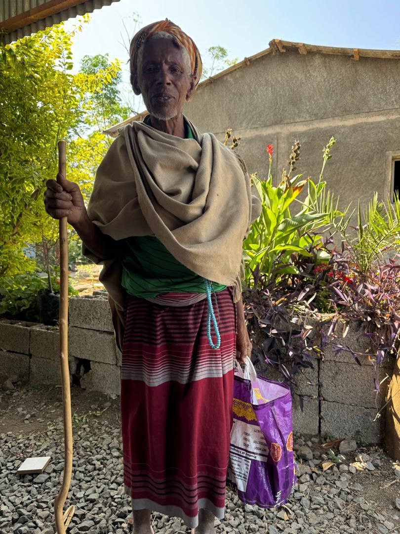 Elderly man with a walking stick
