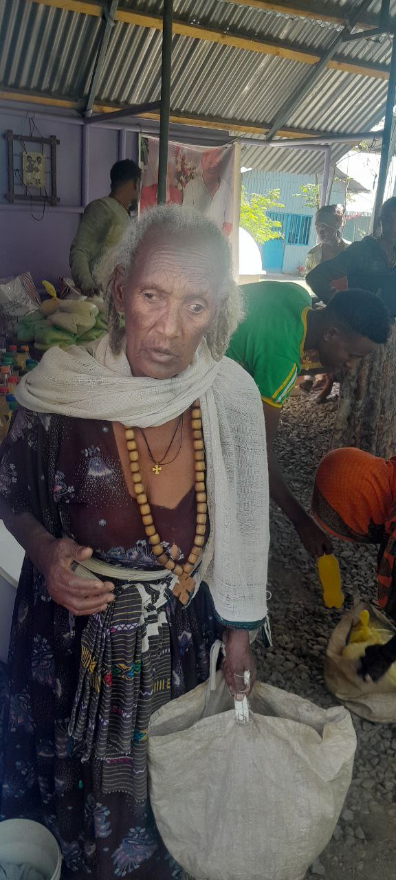Elderly woman receiving aid