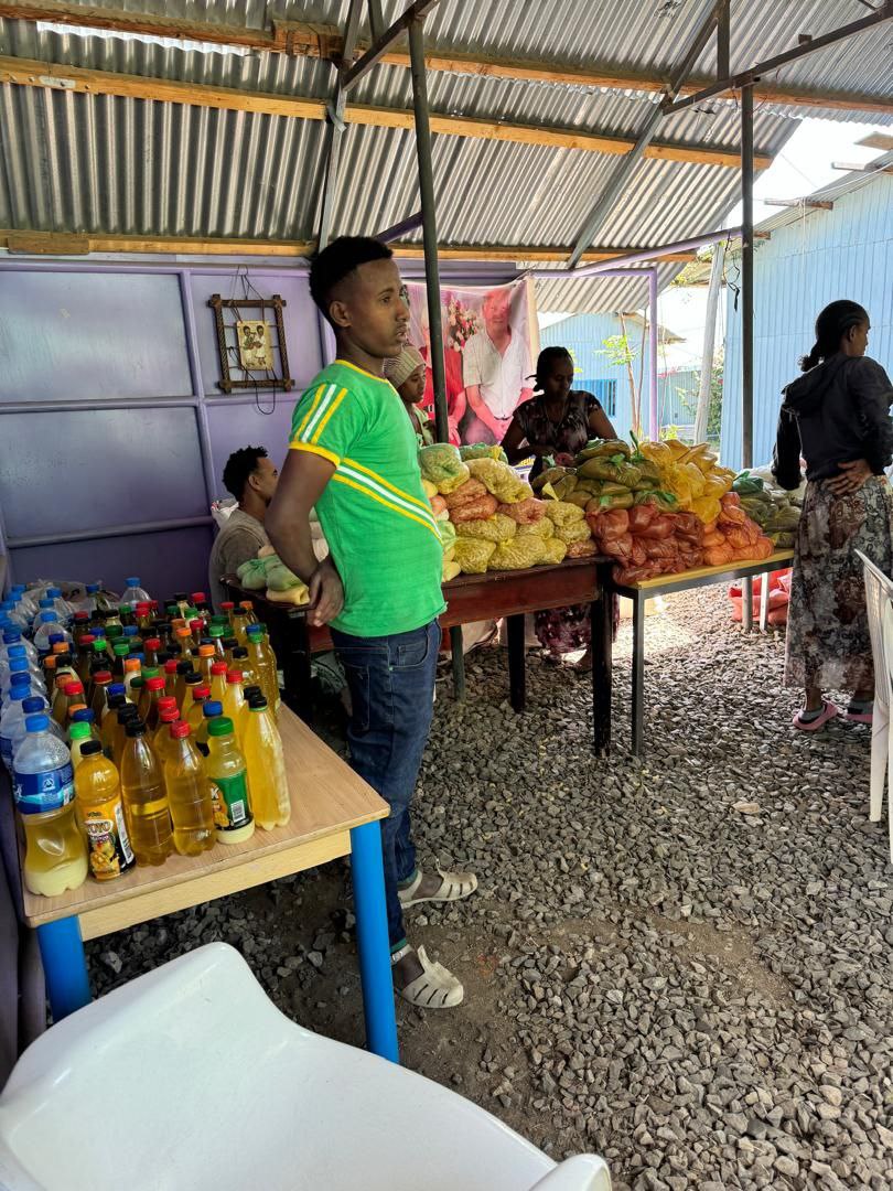 Full market stall with various goods
